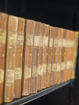 Row of worn Antique books