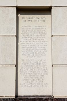 The Plaque of the Golden Boy of Pye Corner in the City of London.  The plaque marks the location where the Great Fire of London was stopped in 1666.