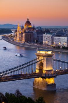 Budapest sunset cityscape with Chain Bridge in front over Danube river and Parliament Building in the background