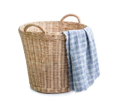 cloth in wicker basket on white blackground