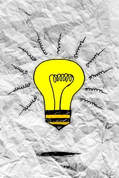 idea concept light bulb on crumpled paper