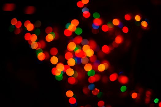 Colorful holiday abstract background in defocus photographed closeup