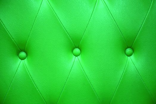 Emerald green color of upholstery leather pattern as background