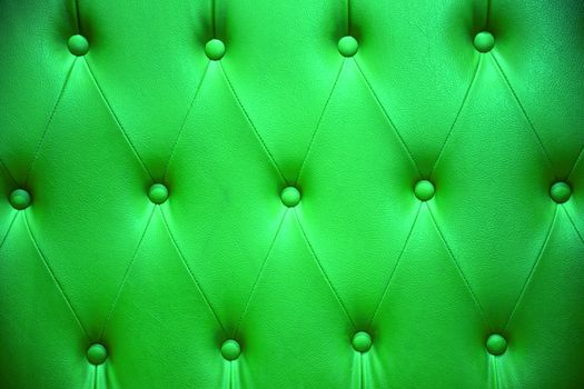 Emerald green color of upholstery leather pattern as background