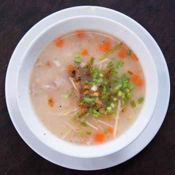 Traditional thai porridge rice gruel in bowl, con gee 

