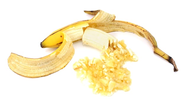 Peeled overripe banana, whole and mashed, isolated on a white background