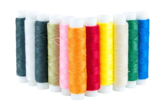 Colored spools of threads isolated on white background