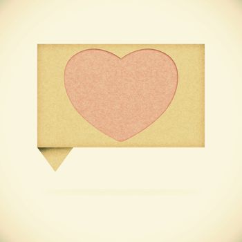 Heart tag recycled paper on vintage tone  background