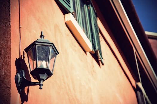 Vintage old-fashion lamp hanging on brick wall