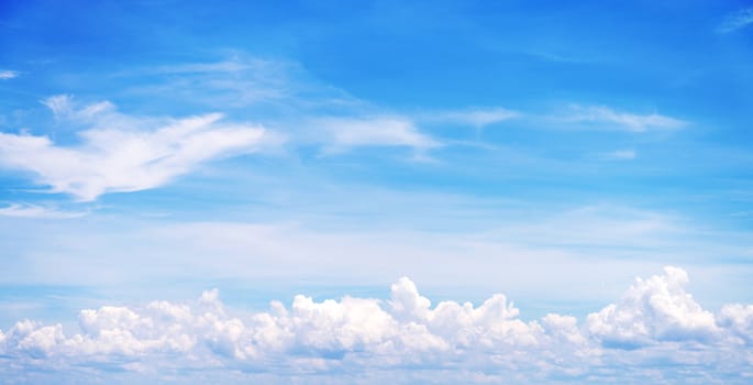 blue sky background with tiny clouds