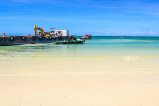 bulldozer working on a beach