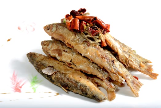 Chinese Food: Fried Small Fish with Pepper on a white plate