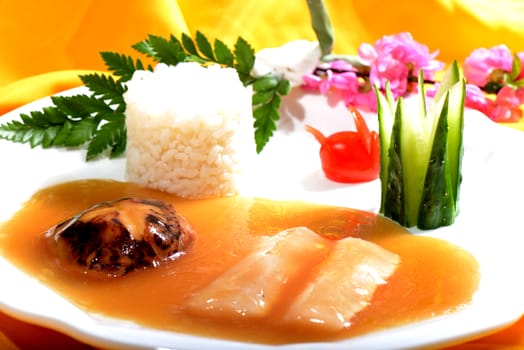 Chinese Food:Fish fillet with Rice on a white plate