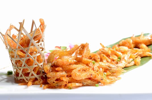 Chinese Food:Fried Shrimp in a bamboo basket on a white background