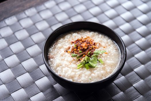 Traditional thai porridge rice gruel in bowl, con gee