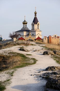 Christian Orthodox church in Old Orhei, Moldova, in rays of sunset