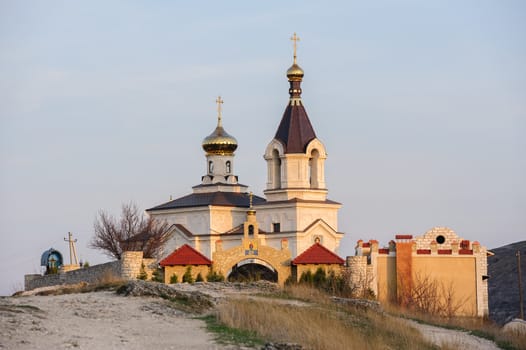 Christian Orthodox church in Old Orhei, Moldova, in rays of sunset