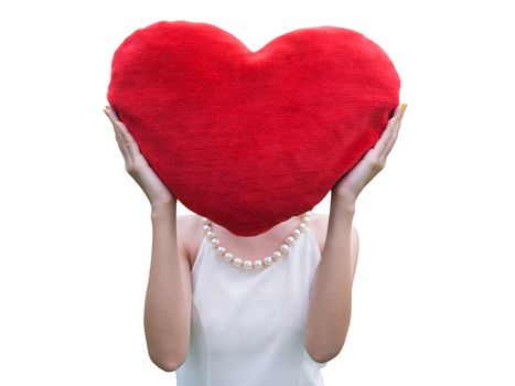 Women holding big love heart shape pillow isolated on white background,