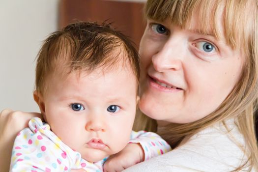 Photo of cute newborn infant girl and mother