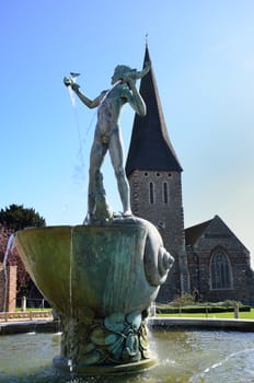 Statue and church in background