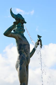 Statue of boy with fish