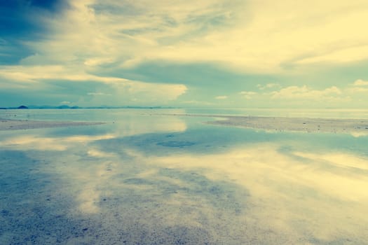 Tropical sea beach with beautiful reflection vintage tone style