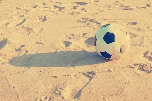 Vintage Soccer ball on sand     