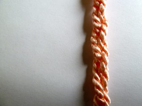 Bright pink plated rope in a straight line