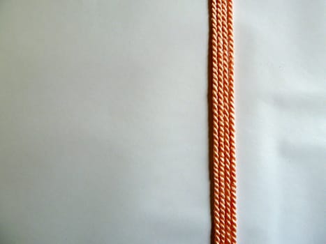 Thin bright orange ropes in a straight line