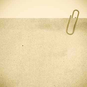 Paper clip and paper on vintage tone style