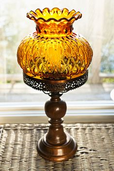 Ornate antique amber glass and wood lamp