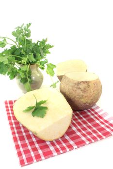 yellow Turnip with parsley and napkin on a bright background