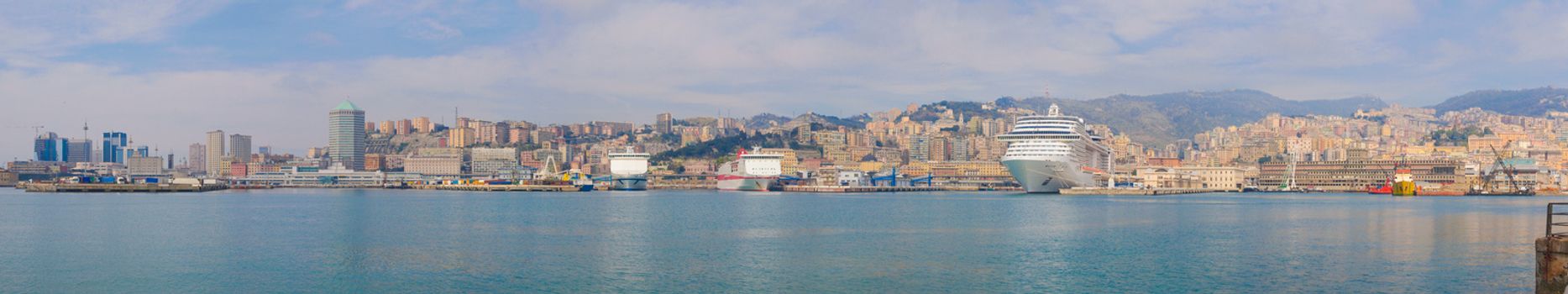 Wide panoramic view of the city of Genoa skyline from the sea