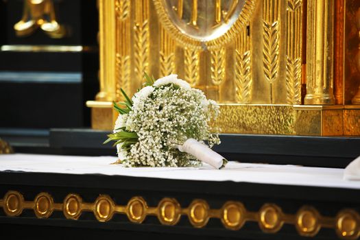 Bridal bouquet on the altar