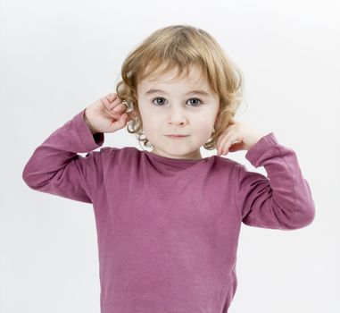 young child with finger in ears isolated on white background