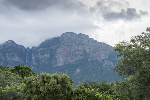 the drakensberg mountains in south africa with bad weather and dark clouds