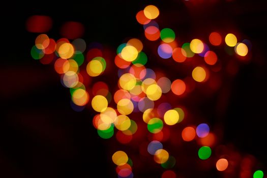 Colorful holiday abstract background in defocus photographed closeup