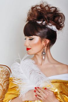 Attractive young woman with high hair and great makeup shot closeup