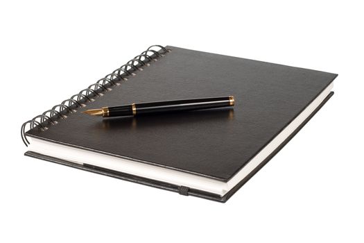 black notebook and the black pen with a gold feather