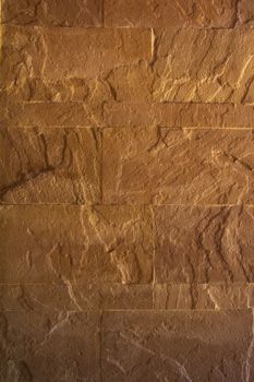 Yellow rough stone texture wall
