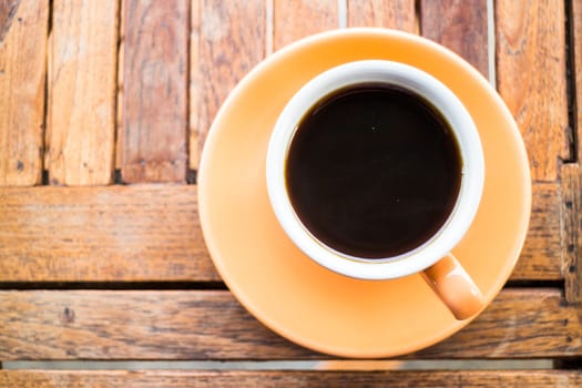 A cup of hot coffee on wooden table, stock photo