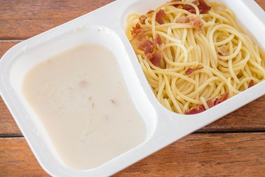 Box set of spaghetti carbonara with bacon and cheese, stock photo