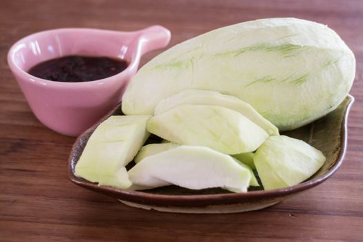 Green mango serving with sweet sauce, stock photo