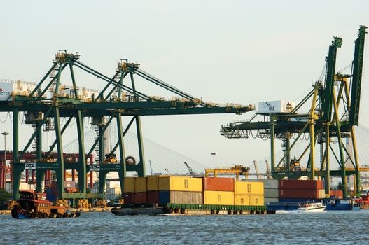 HO CHI MINH CITY, VIET NAM- MARCH 14: Shipping system at Cat Lai port, elevator loading container of freight to vessel, service for import, export good in maritime transport, Vietnam, March 14, 2014