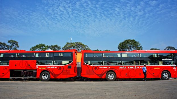HO CHI MINH CITY, VIET NAM- DEC 23: Passenger bus at car parking, double decker vehicle to transport  stand at garage under blue sky with cloudy, Hochiminh, Vietnam, Dec 23, 2013