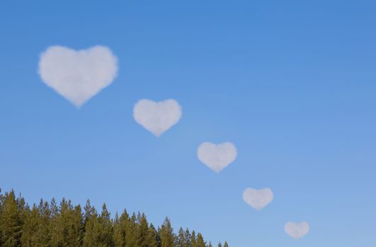 Clouds in shape of heart come afar. collage on background blue sky