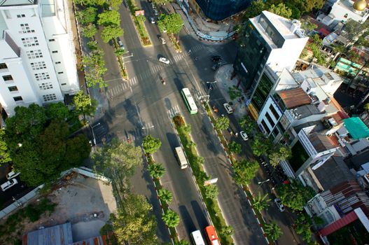 HO CHI MINH CITY, VIET NAM- MAR 23: Panoramic of Ham Nghi street in Ho Chi Minh city from high view, residential, office building with green trees on road, Sai gon is big city in Vietnam, Mar 23, 2014