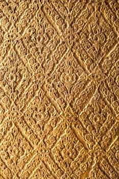 The background pattern is carved with the Thai national identity.