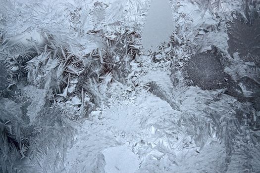 View of  frost on  glass window. Image with shallow depth of field.