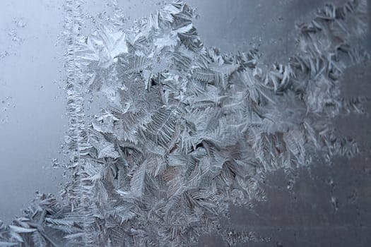 View of  frost on  glass window. Image with shallow depth of field.